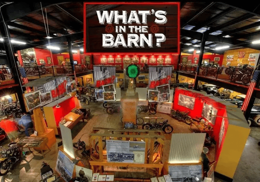 Motorcycle museum interior with vintage displays.