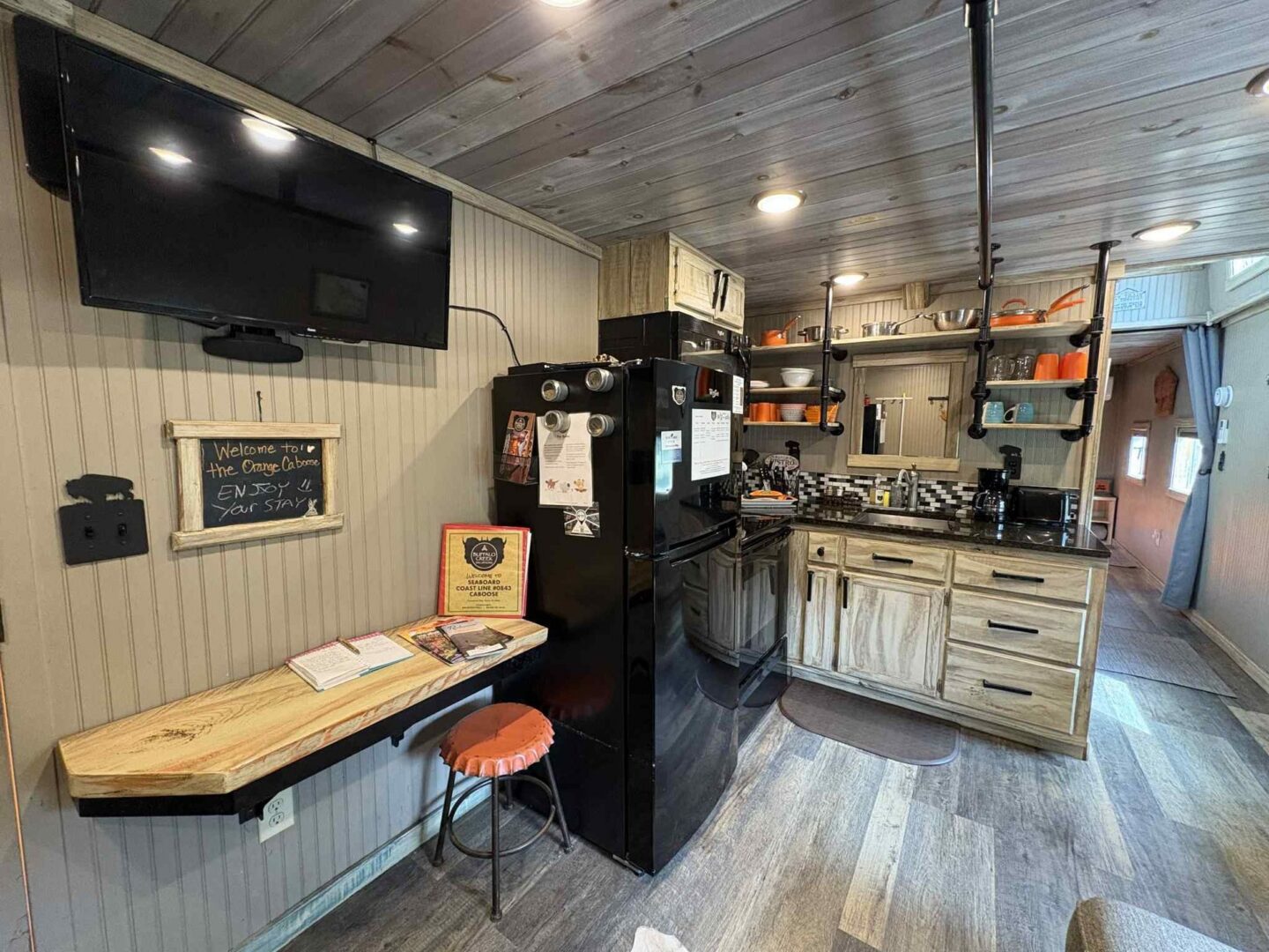 Cozy kitchen with wooden accents and appliances.