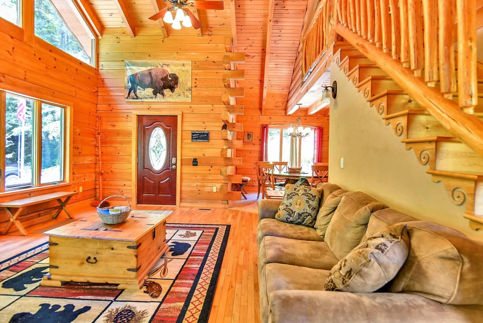 Cozy wooden cabin interior with staircase.