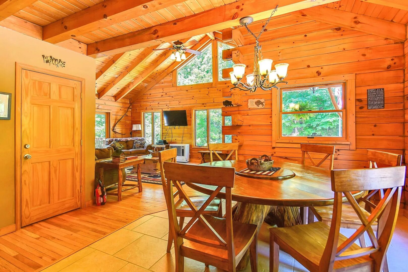 Rustic wooden cabin interior with dining table.