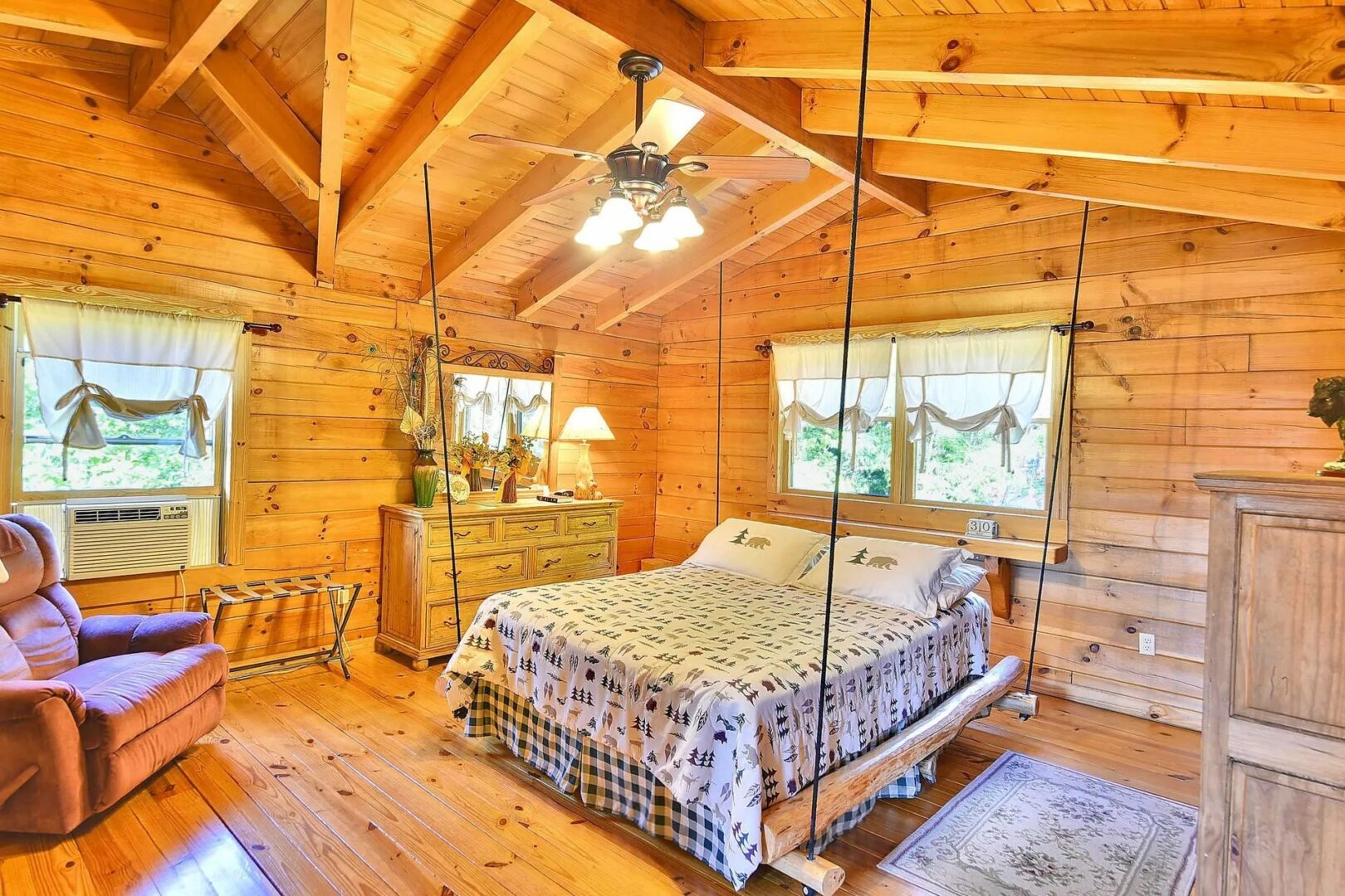 Rustic wooden bedroom with cozy decor.
