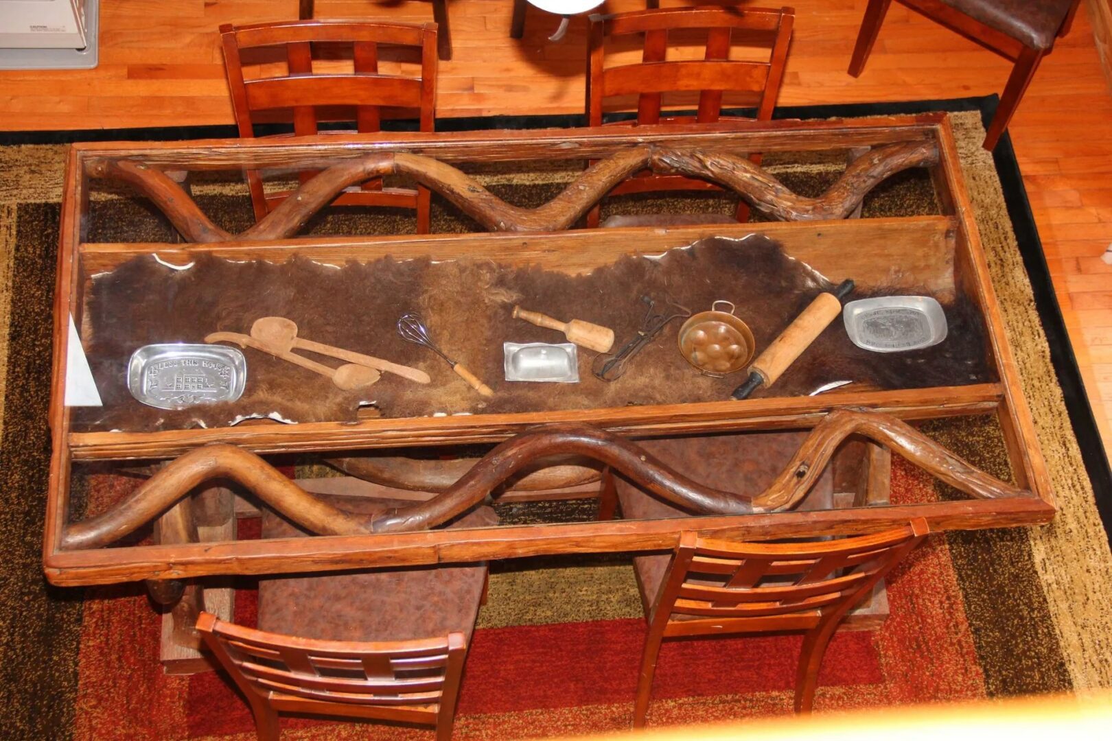 Wooden dining table with decorative items.