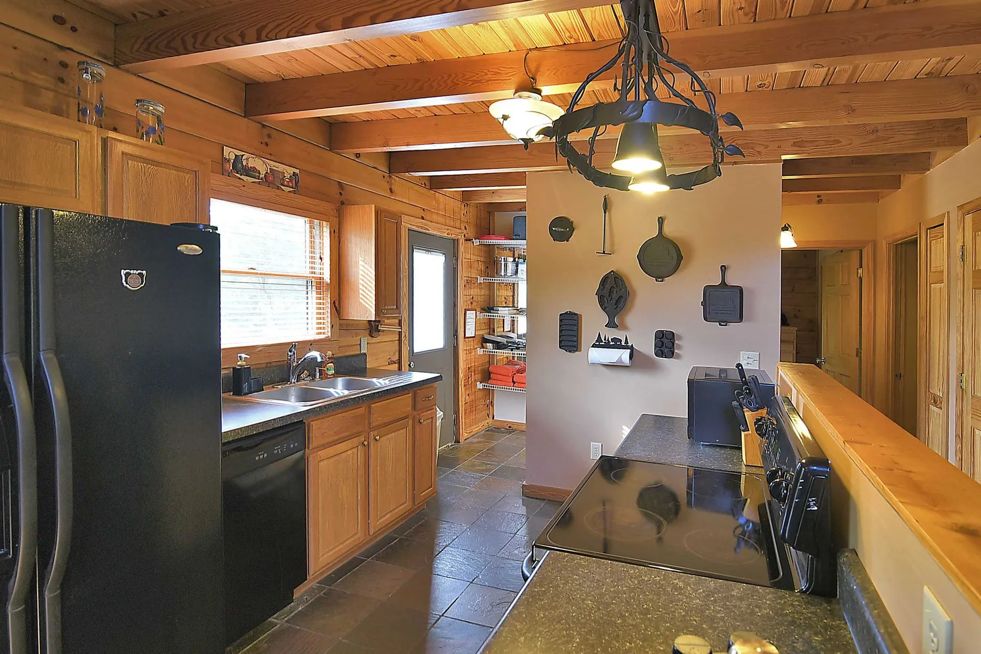 Modern rustic kitchen with wooden beams.