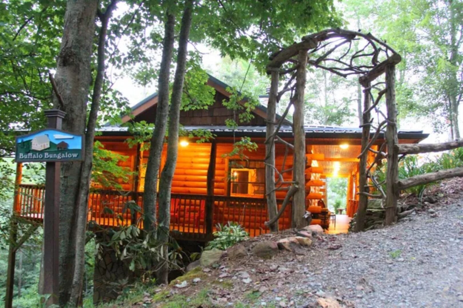 Cozy log cabin surrounded by trees.