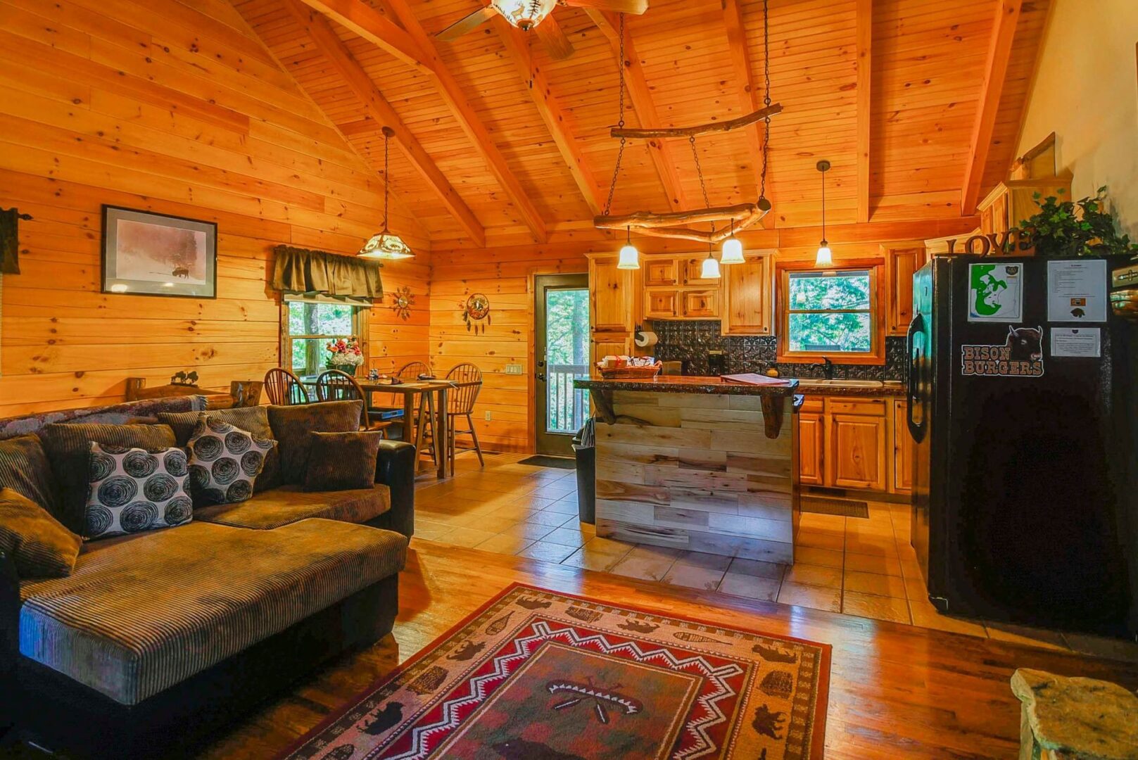 Cozy cabin interior with wooden furnishings.