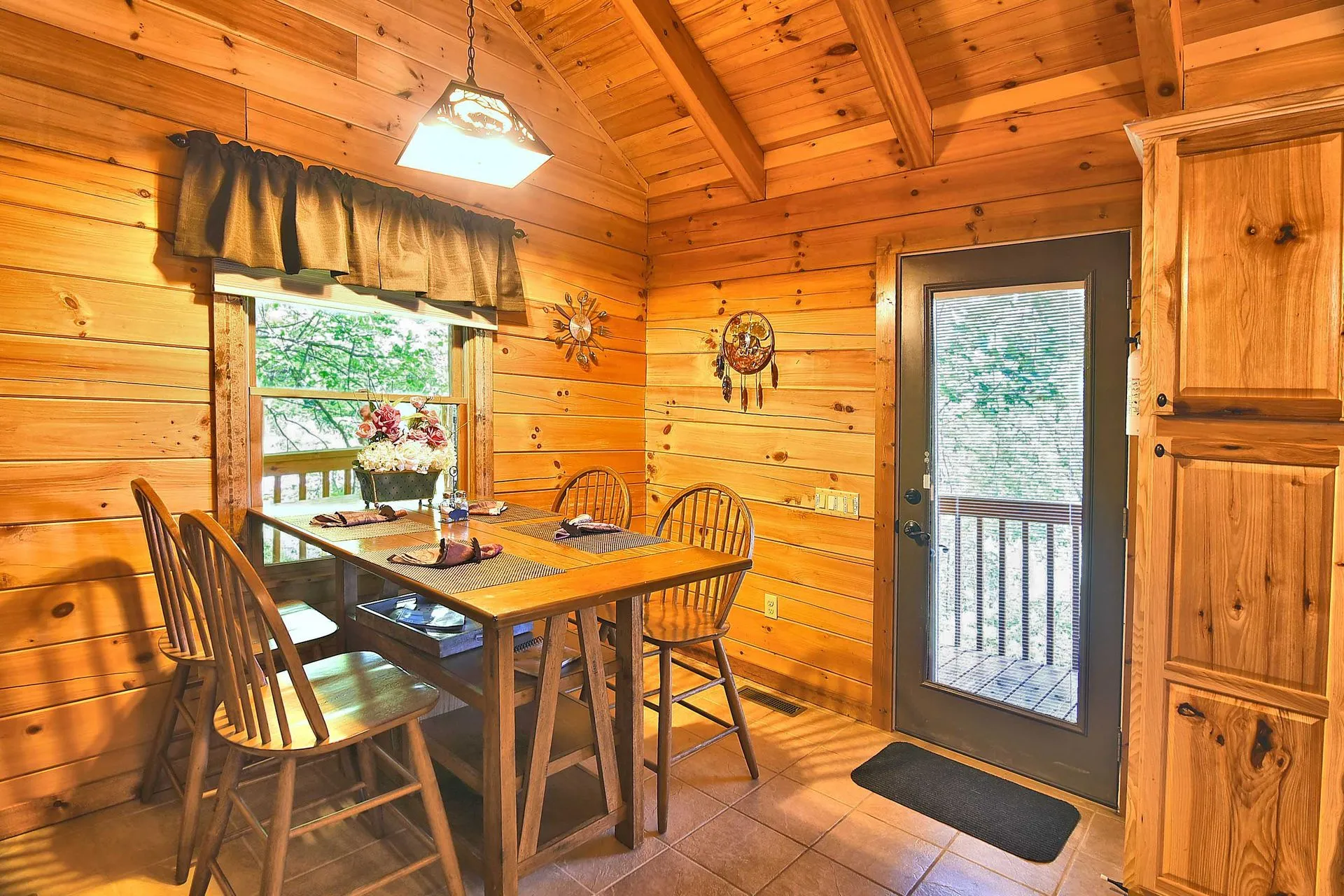 Rustic kitchen with wooden dining table.