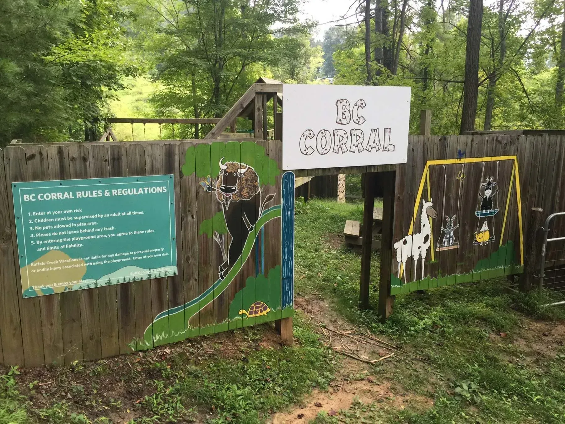 BC Corral wooden gate with painted animals.