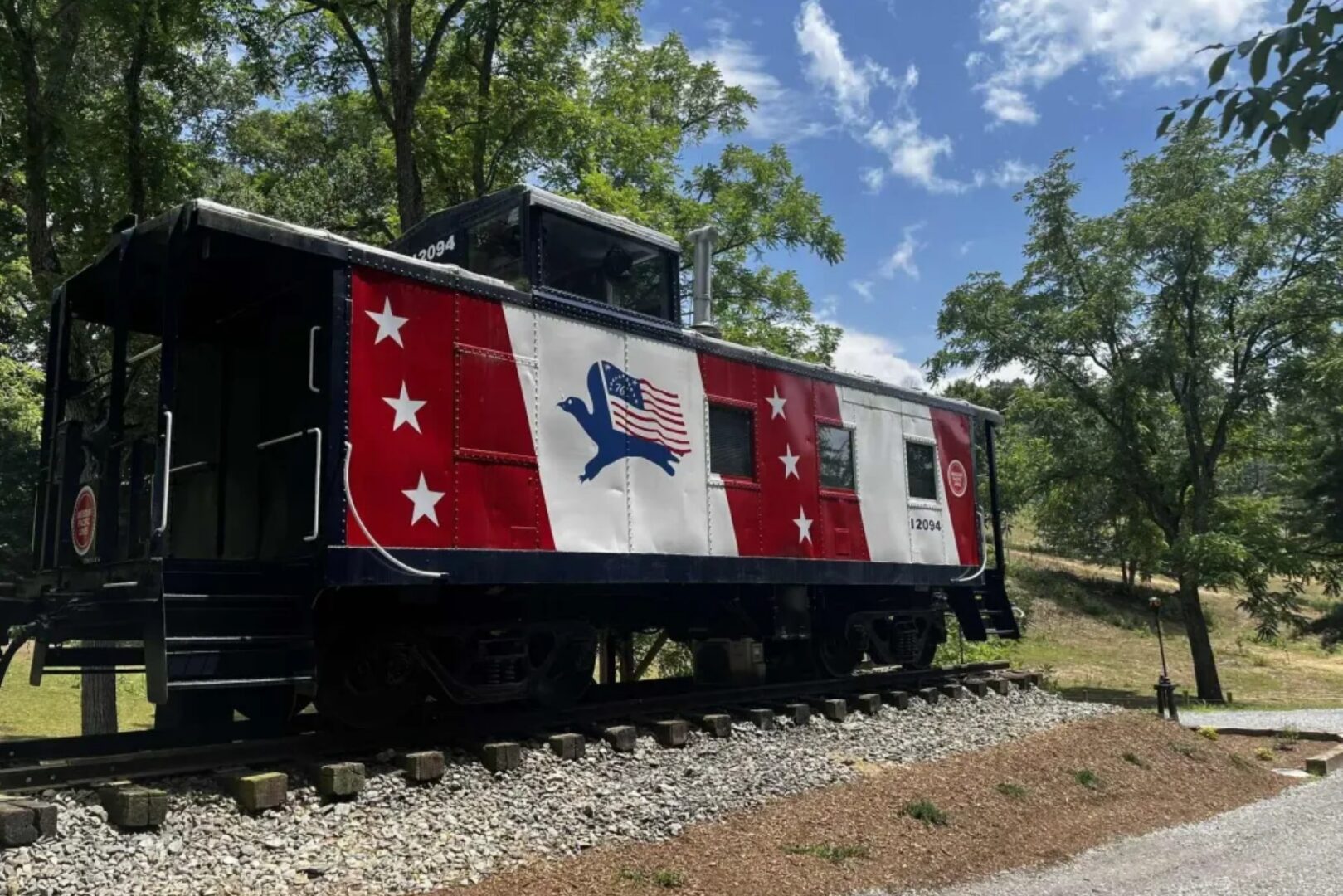 Patriotic train car with flag design.