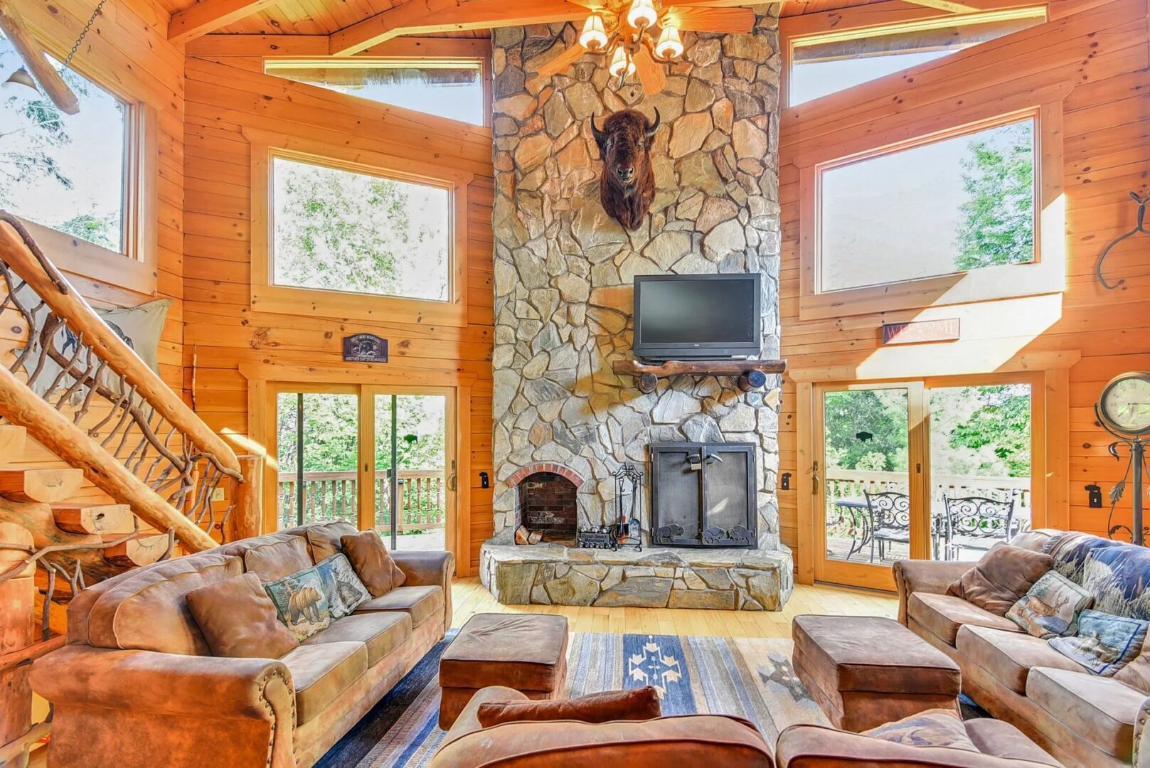Rustic living room with stone fireplace.
