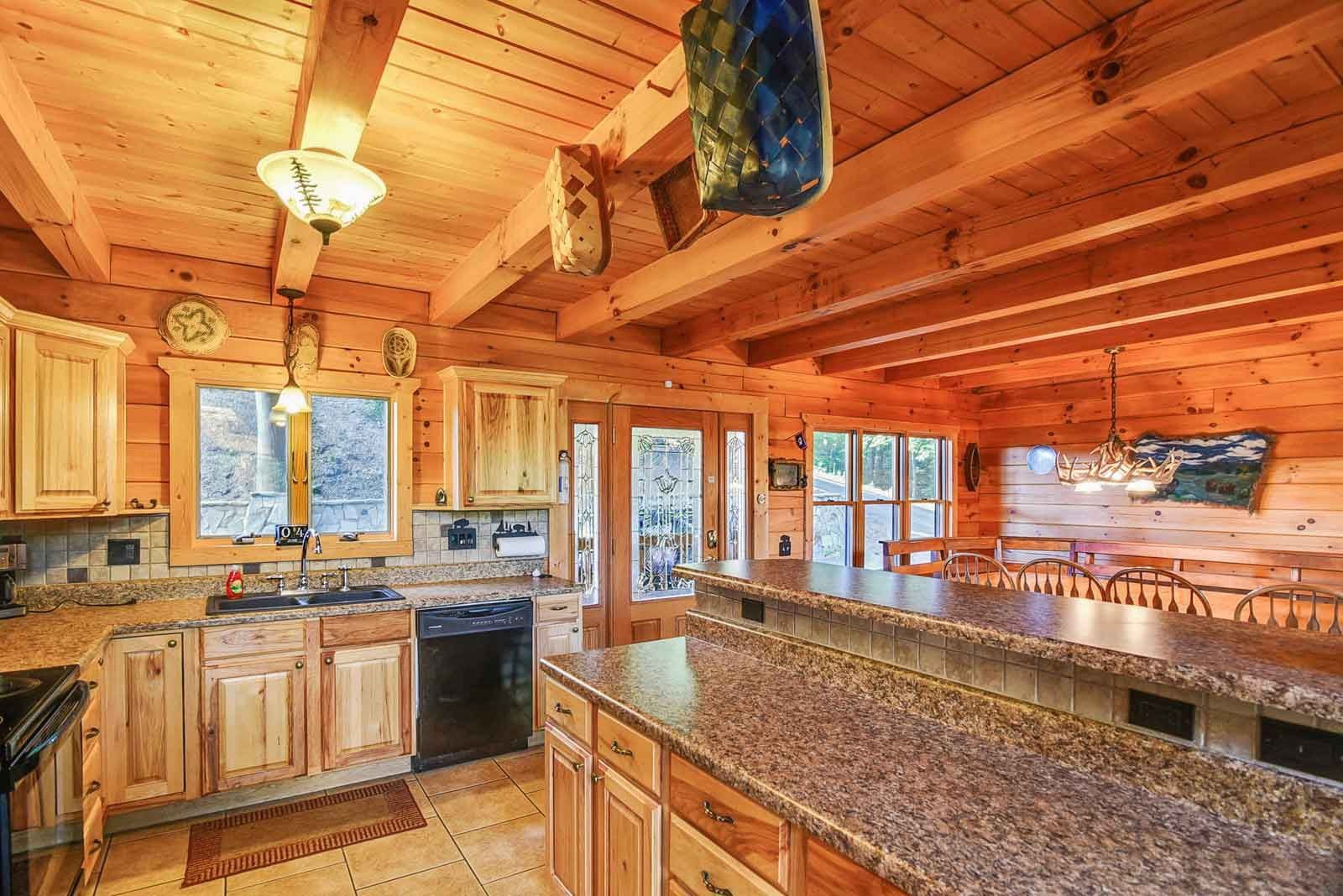 Rustic wooden kitchen with granite countertops.