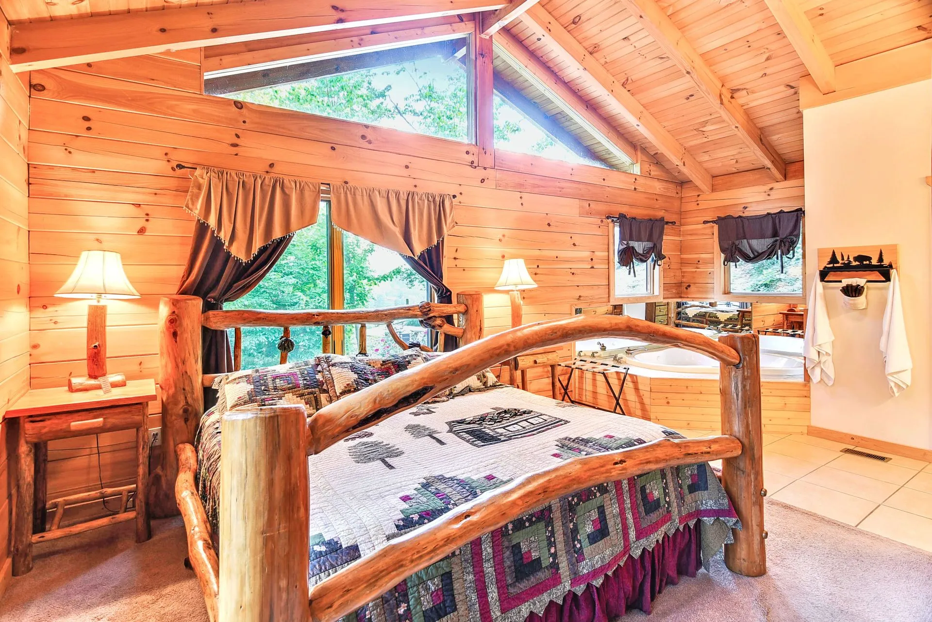 Rustic bedroom with wooden furniture and quilt.