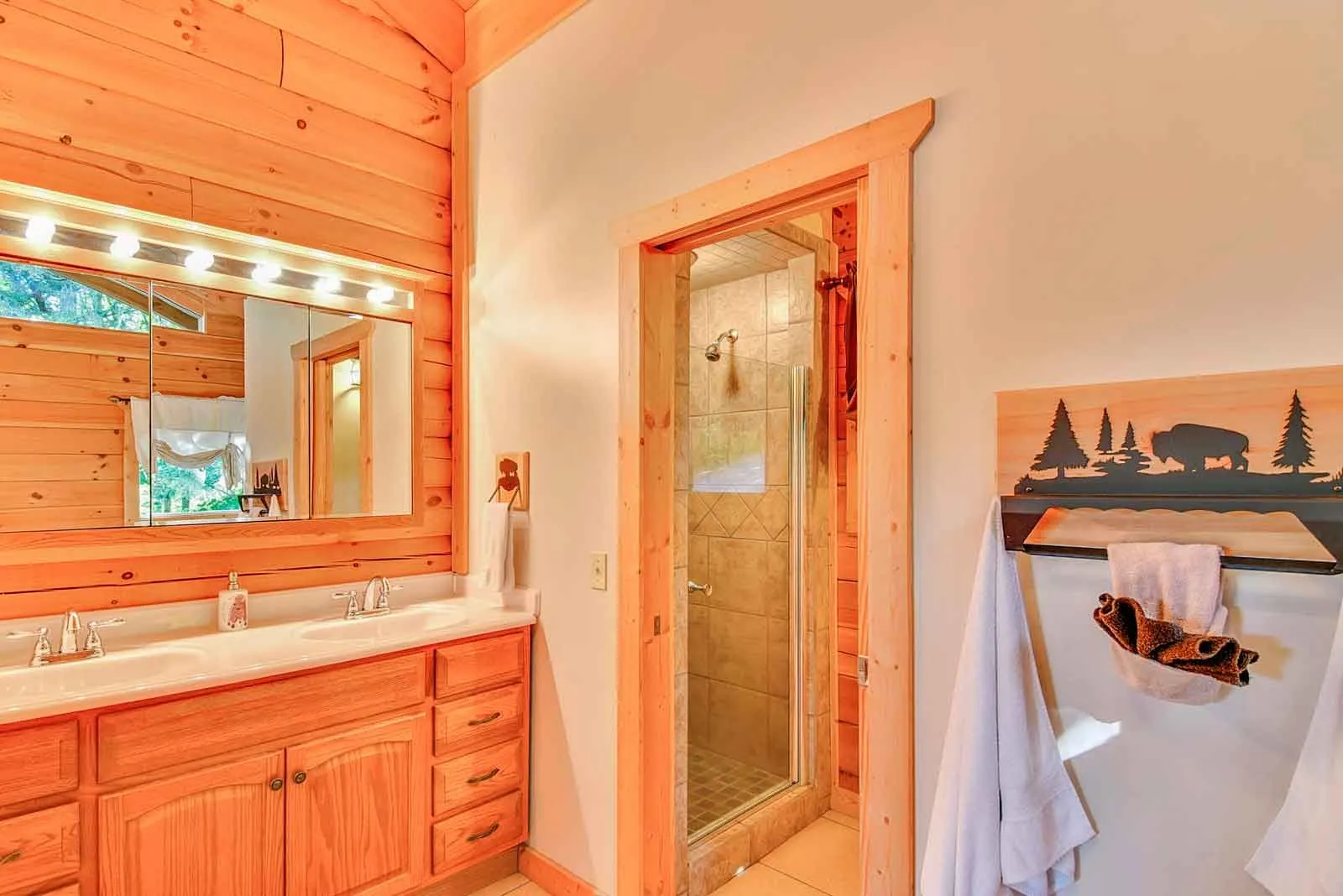 Rustic bathroom with wooden decor and shower.
