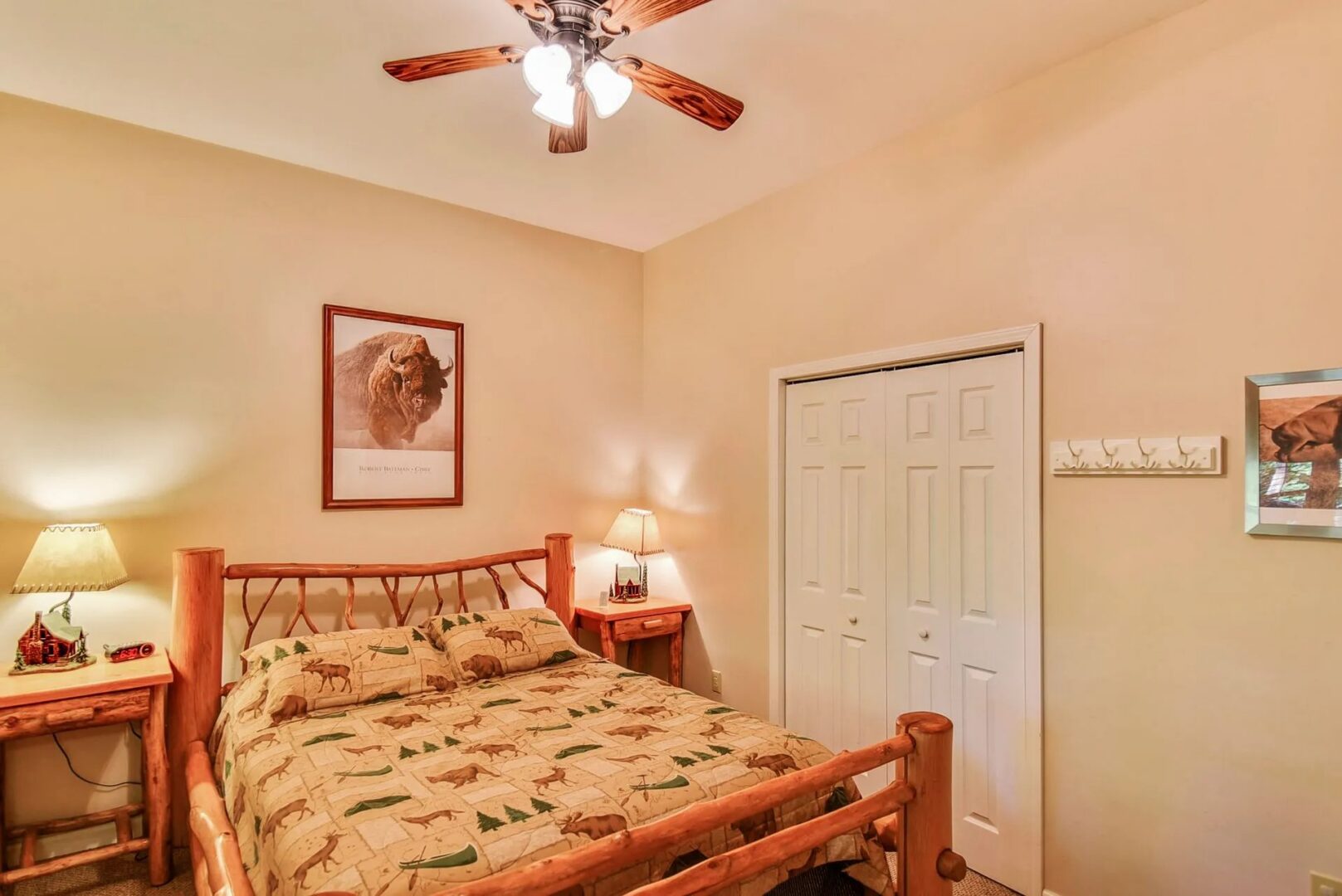 Cozy bedroom with wooden bed and lamps.