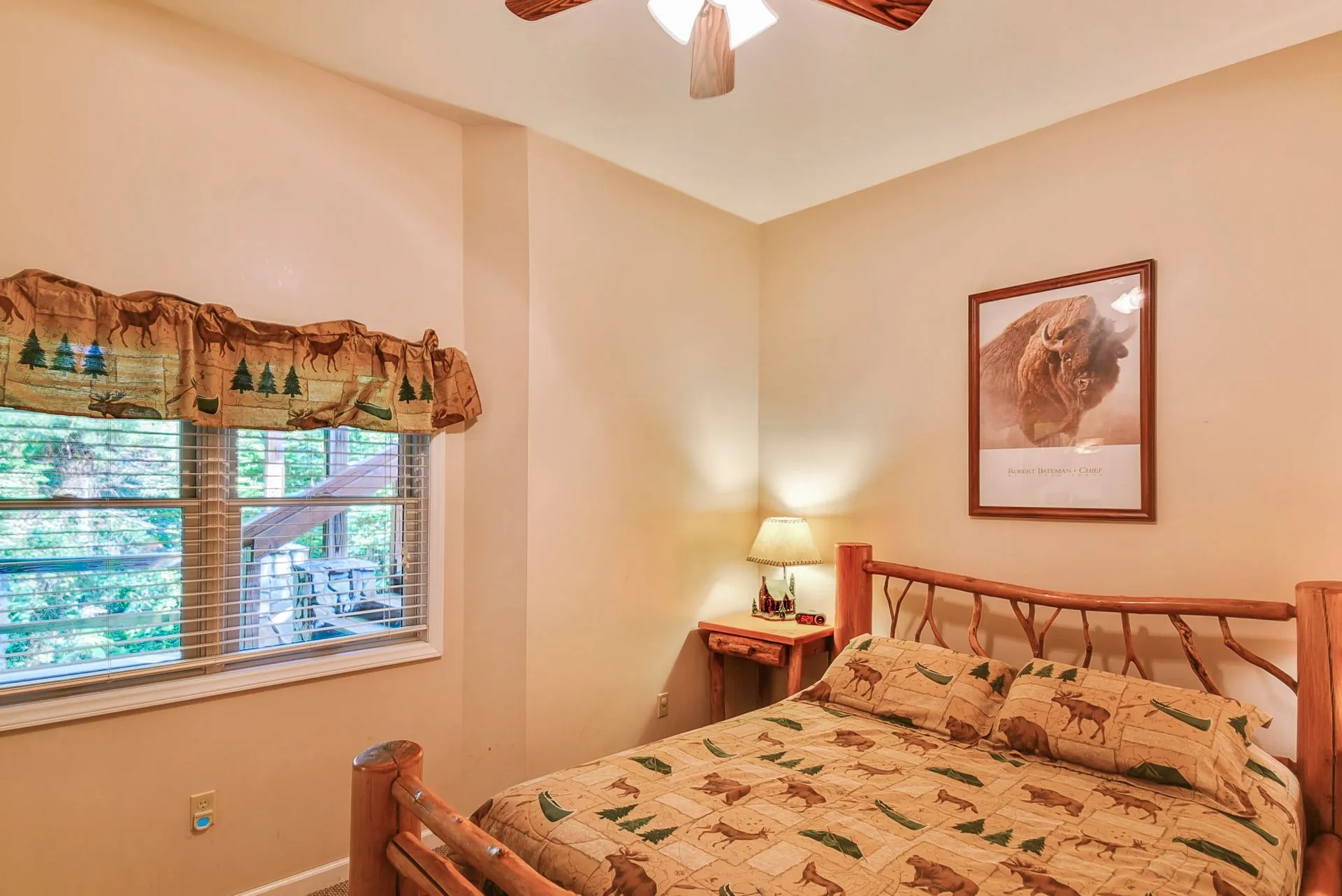Rustic bedroom with nature-themed decor.