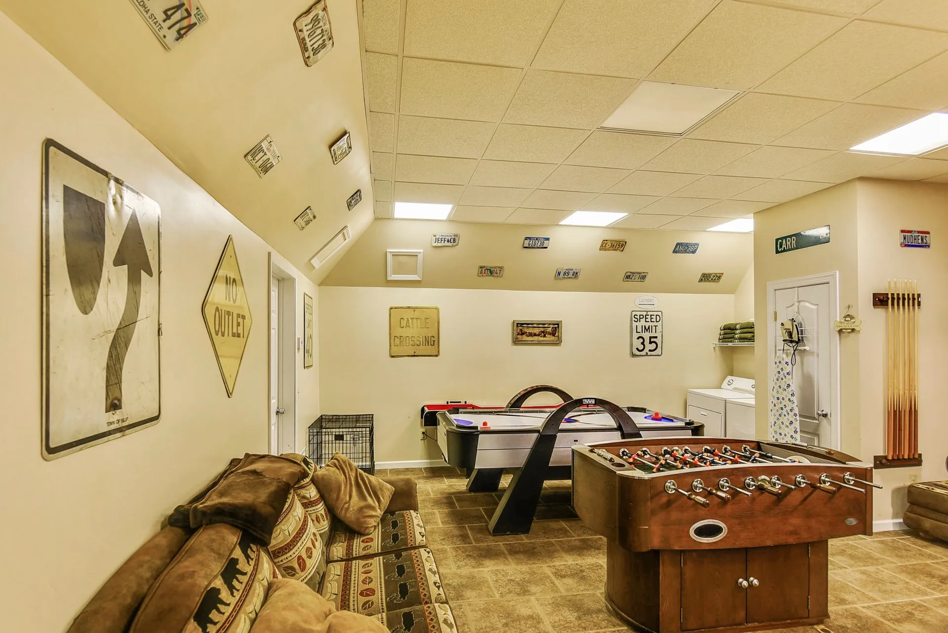 Game room with foosball and pool tables.