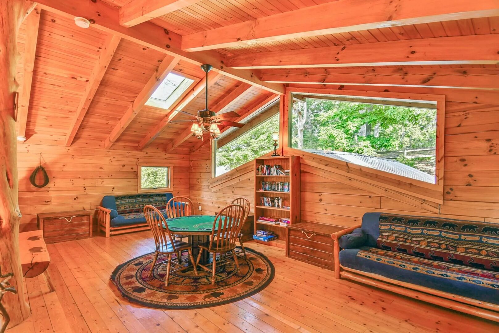 Cozy wooden cabin interior with skylights.