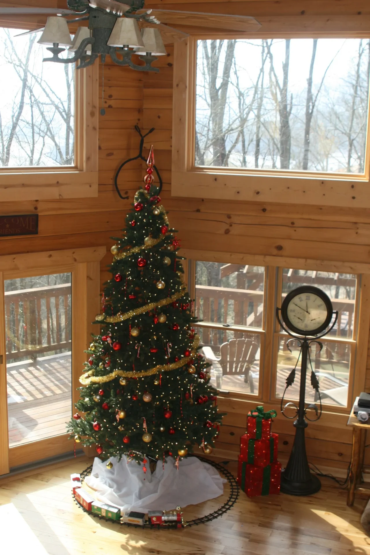 Christmas tree in cozy wooden living room.