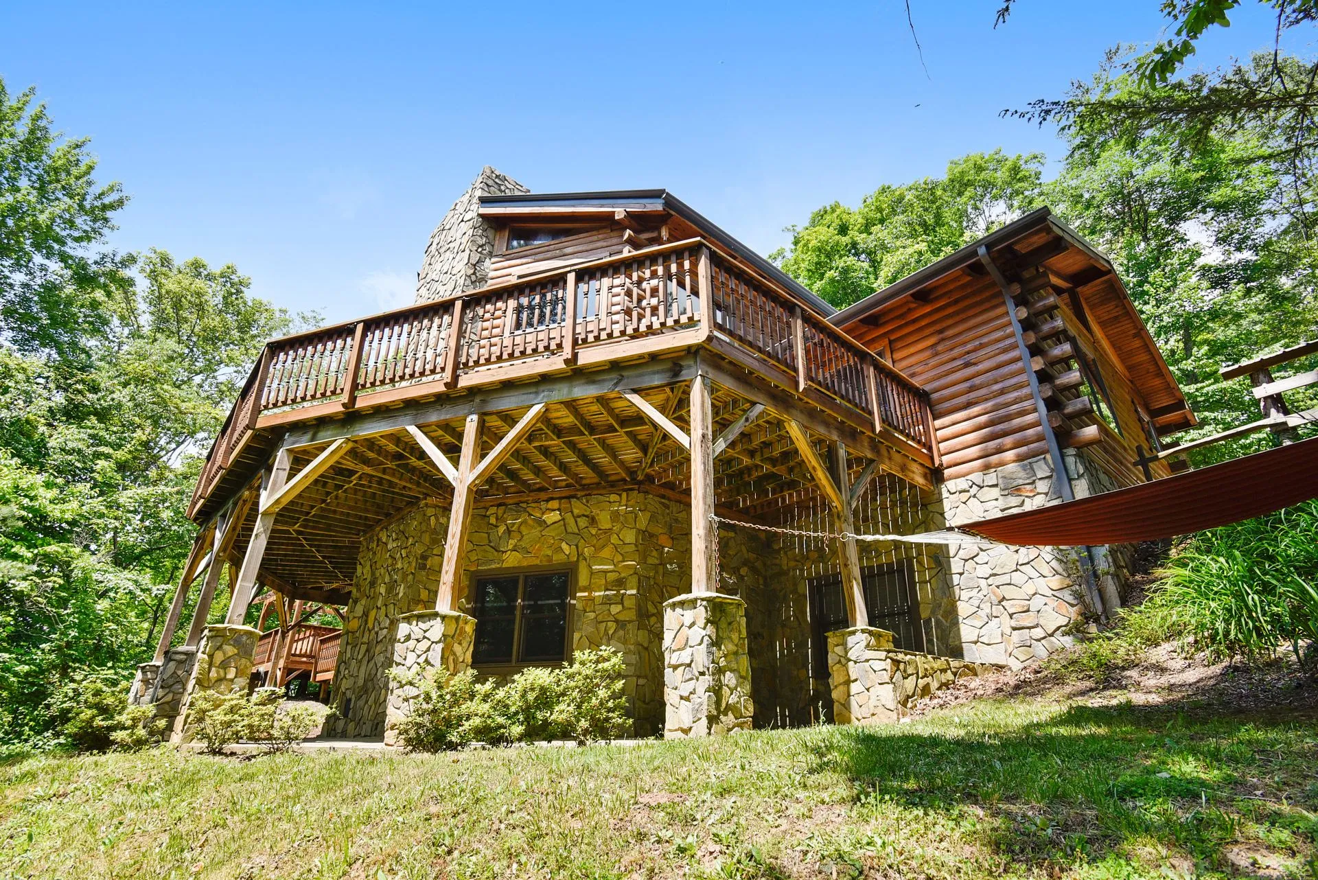 Rustic cabin with stone and wood exterior.