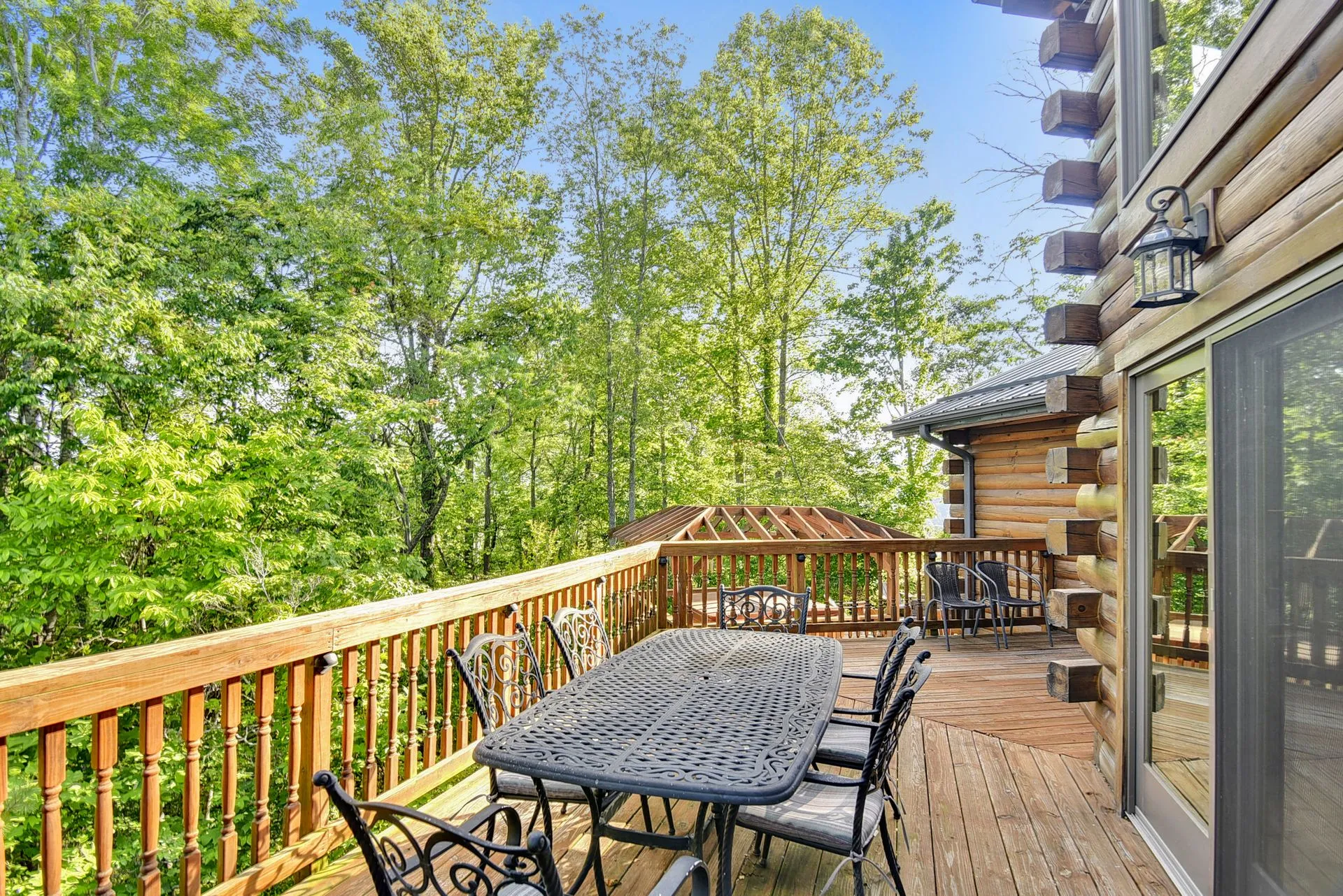 Wooden deck with outdoor dining table.